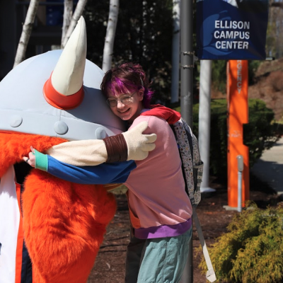 Student Hugging Superfan