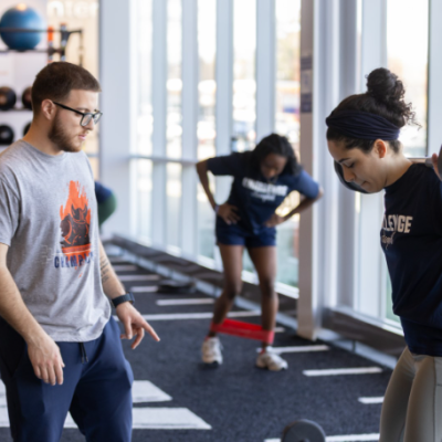 Trainer working with a student.