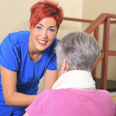 An occupational therapist works with an older client
