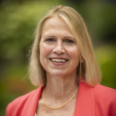 Wendy Davison wearing a coral blazer and white shirt