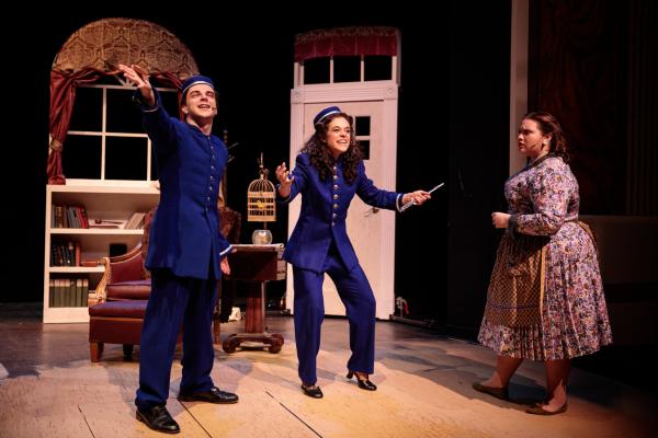 Theatre students dress up in bellhop costumes during a performance at Salem State.