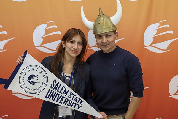 A female student and her father in the photobooth at Accepted Students Day