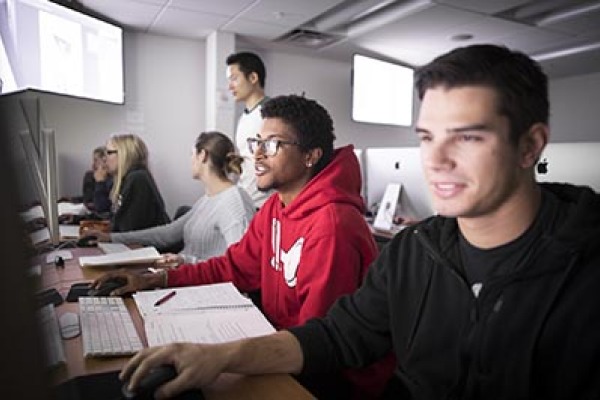 Students gather together in the communications lab. 