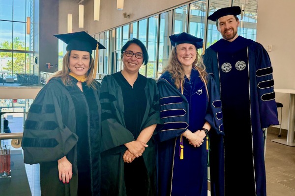 Graduate program coordinators at commencement