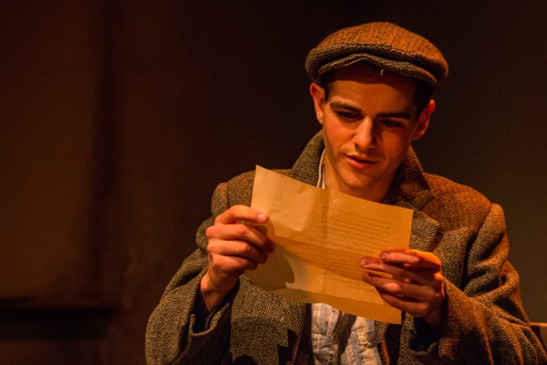 An actor reads onstage