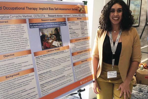 Camacho Martinez with her presentation board at the Massachusetts Association of Occupational Therapy conference