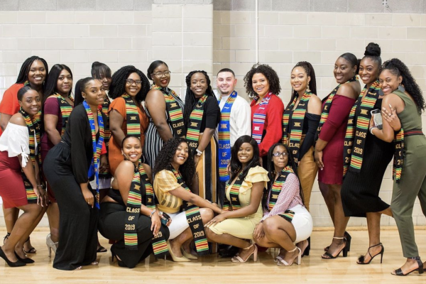 A group photo of graduates during the ALANA ceremony wearing their stoles