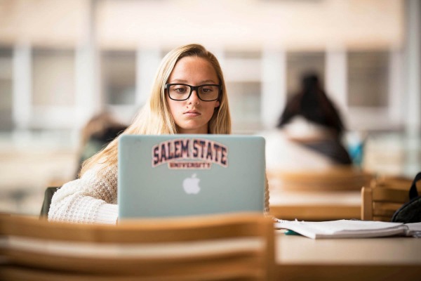 A student studying on her laptop