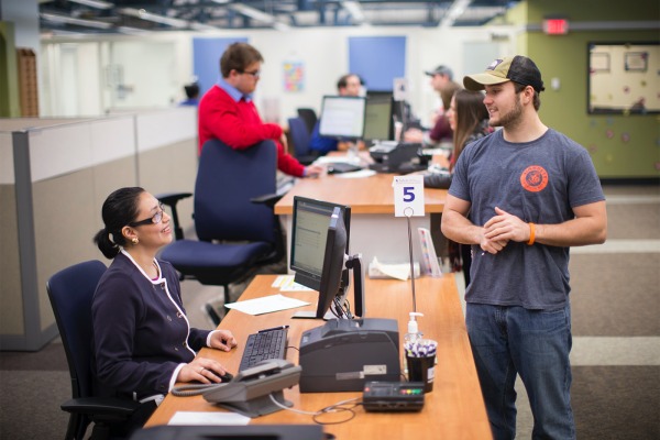 A Student Navigation Center staff member helping a student