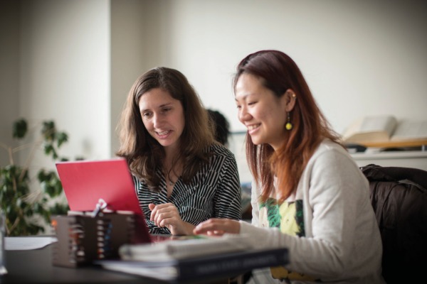 Two students at a desk