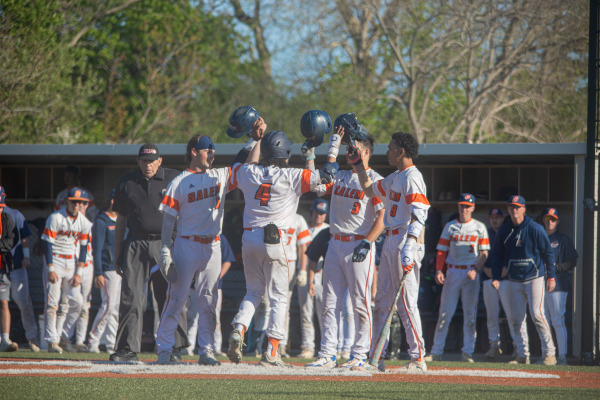 Baseball team celebrates on the mound