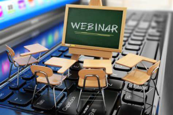 Webinar written in chalk in a round table group for students