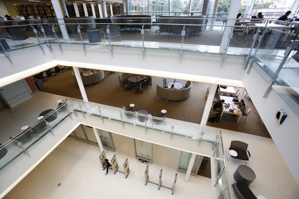 inside library, at top of central stairs, looking down into lobby