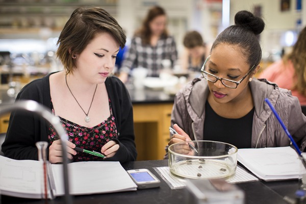 Two female students in a biology lab 