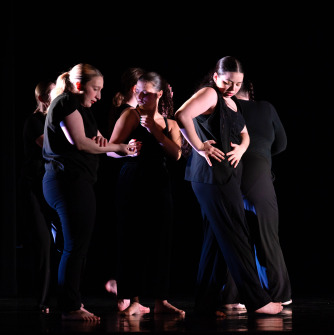 A group of 4 dancers in a  group