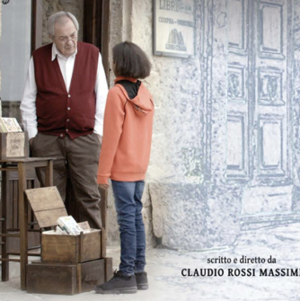 In a movie poster, a girl stands and looks at an old man on the streets of Italy.