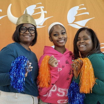 3 women wearing viking hats for Salem State