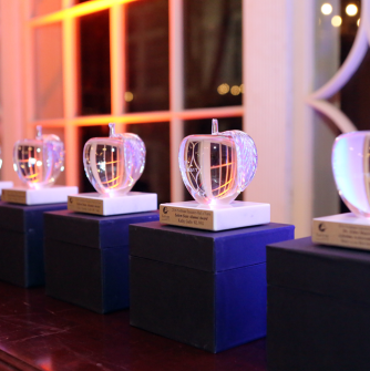 Glass apples that are displayed for awards ceremony