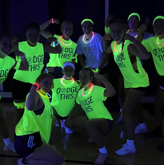 Salem State students at Blacklight Dodgeball pose for a photo