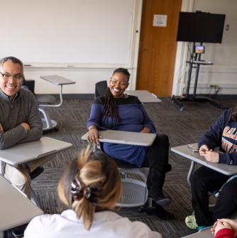 Students in a study group with professor