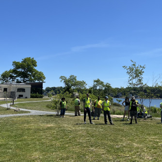 students flying drone in ocean park