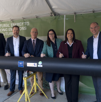 President Keenan and project partners sign the final pipe in the geothermal installation