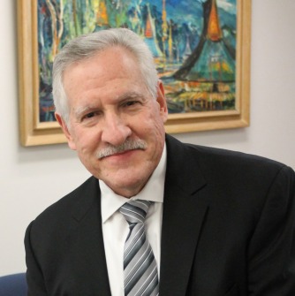 Former DHE Commissioner Carlos Santiago