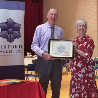 Lisa Delissio receives HSI award from Essex County District Attorney Paul Tucker