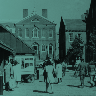 Black and white photo of Old Town Hall with people and cars
