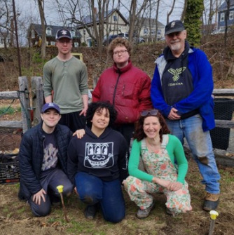 Kate Adams and Dr. Piñeros Shields on the farm with student volunteers 
