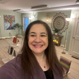 Maria Bakas '01 in her Reiki studio