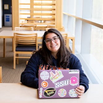 Student sitting with laptop