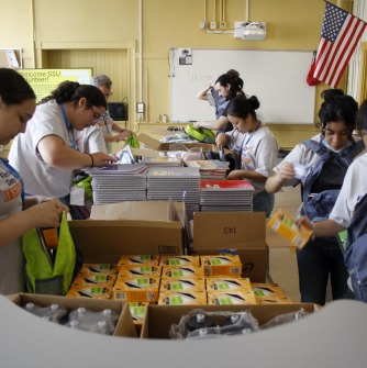 Vikings pack backpacks full of supplies at Salem's Collins Middle School