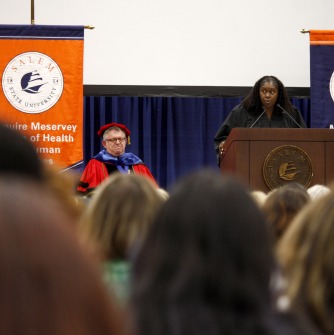 Virginia Lyons, a 2016 graduate, delivers the 2025 Convocation address