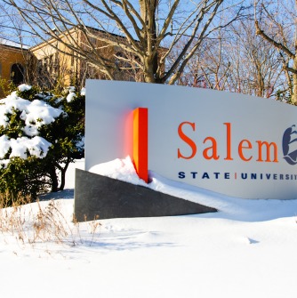 The Salem State University sign on North Campus in the snow