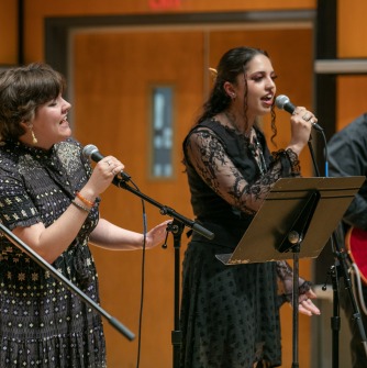 Singers and a guitar player performing in the Recital Hall