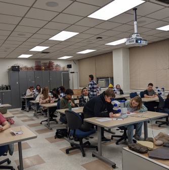 students are using microscopes