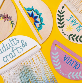 Wooden signs with names and different painted shapes