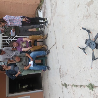 Danny teaching trainees how to fly the drone