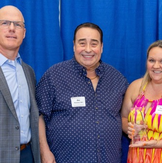 Pictured above: President John D. Keenan; Joseph M. Wamness '00G, past board member, Salem State University Alumni Association and Foundation; and Leanne McGuinness ’17