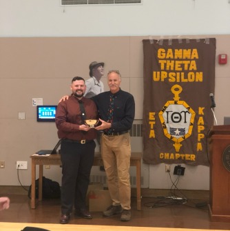 Elden Hubisz receives J. Michael Ruane Award from Professor Stephen Young