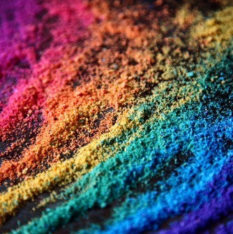 colored sand strewn in layers making a rainbow effect