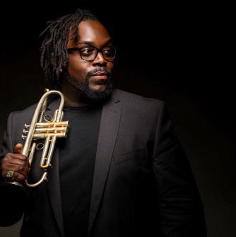 Marquis Hill holding trumpet