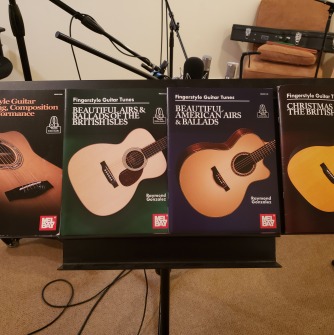 Image of Professor Gonzalez' four song books with Mel Bay
