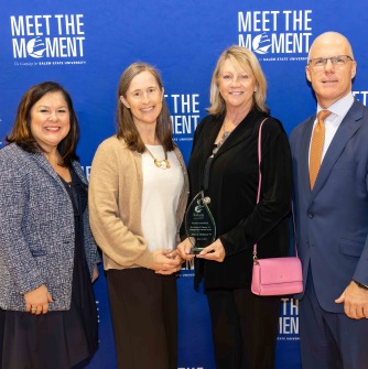 L to R: Vice President Cheryl Webster Crounse, Joyce Vyriotes, executive director and trustee, Cummings Foundation, Denise McKeown, and President John D. Keenan