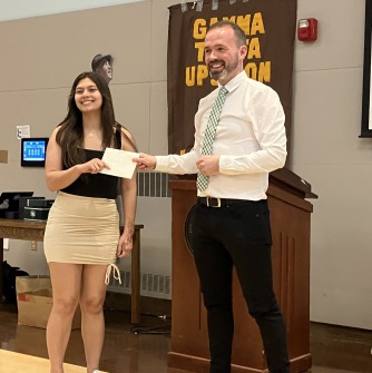 Chanda Wallace receives SSU Social Justice Scholarship from Professor Noel Healy