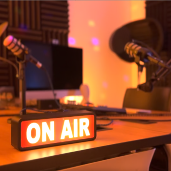 "On Air" Sign in Studio 148's audio corner, with audio equipment in the background