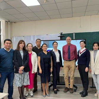 Professor Young with faculty from the Artificial Intelligence & Big Data Department