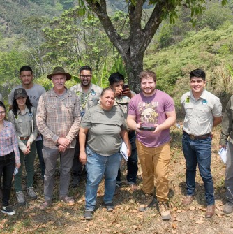 Professor Young and Danny Szottfried (holding drone controller) with drone trainees.