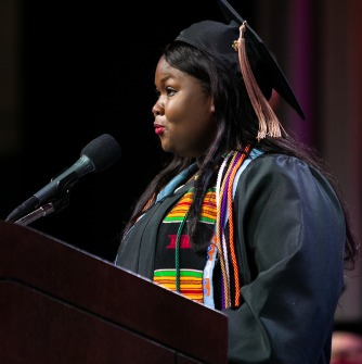 Fatoumata Binta Diallo addressing commencement from the podium